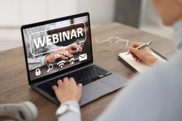 Webinar.,Woman,Using,Laptop,At,Table,,Closeup