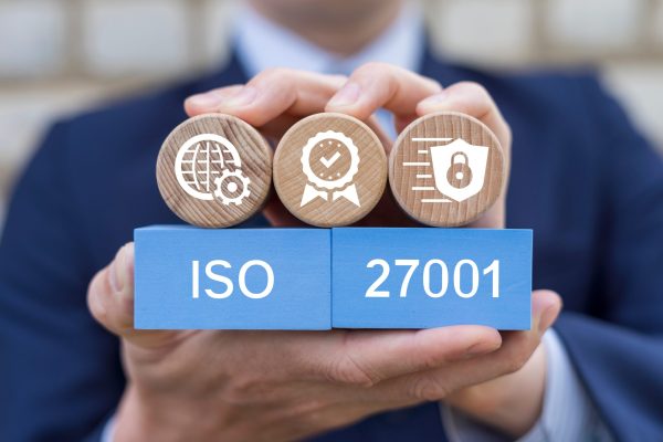 Man,Holding,Blocks,With,Icons,Sees,Text:,Iso,27001.,Iso