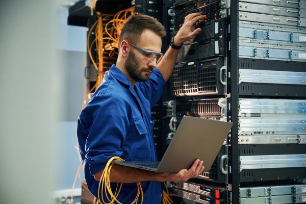 Using,The,Laptop.,Young,Man,Is,Working,With,Internet,Equipment Using,The,Laptop.,Young,Man,Is,Working,With,Internet,Equipment