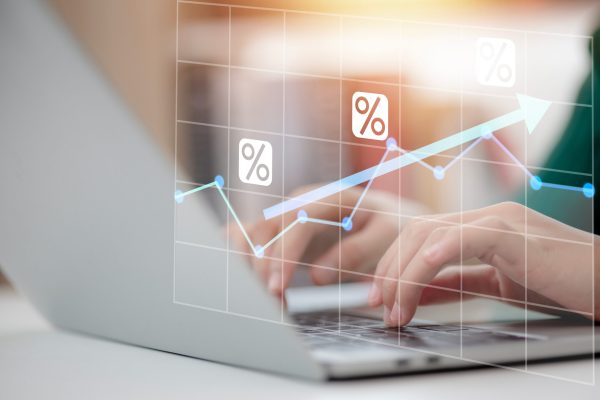 A,Person,Is,Typing,On,A,Laptop,With,A,Graph